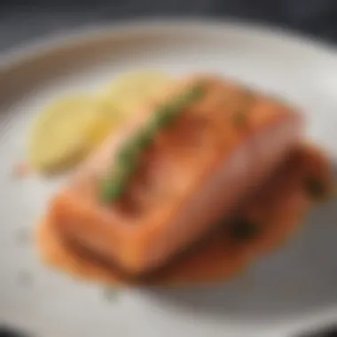 Plated salmon dish garnished with herbs and lemon