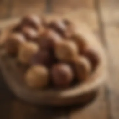 An assortment of homemade energy balls displayed on a rustic wooden board.