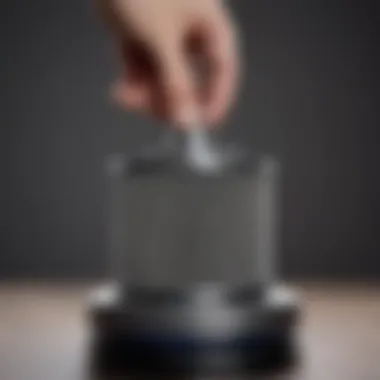 Close-up of a Dyson vacuum filter being cleaned.