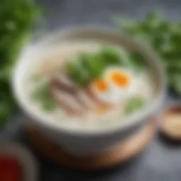 A bowl of silky congee topped with fresh herbs and garnishes