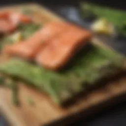 Fresh asparagus and salmon on a wooden cutting board