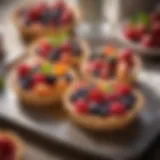 Colorful fruit tarts adorned with fresh berries