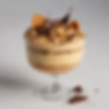 An elegant dessert featuring butterscotch peanut butter mousse topped with chocolate shavings.