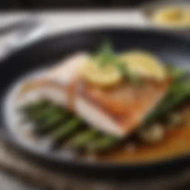 An elegant skillet dish showcasing seared fish served with a side of asparagus and lemon.