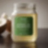 Glass jar filled with liquid coconut oil showcasing its clarity and texture