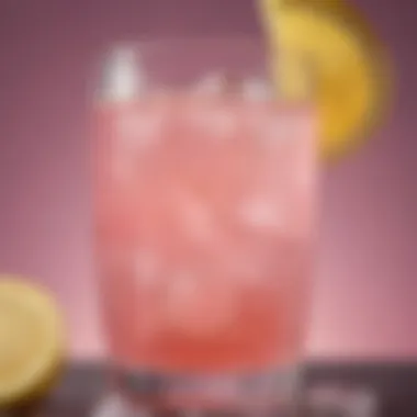 Close-up of a refreshing glass of Mountain Dew Pink Lemonade with ice and lemon slices