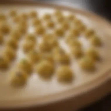 A chef's perspective of tortellini being crafted with precision and care