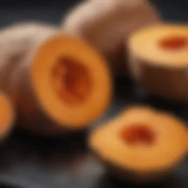 A close-up of a sweet potato cut in half, revealing its creamy texture inside.