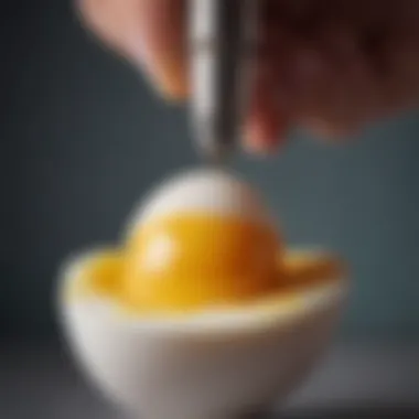 Close-up of an egg being pierced with a tool