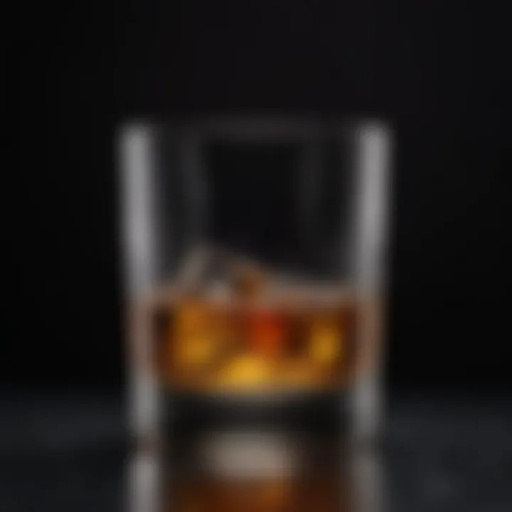 An elegant whisky glass filled with a rich amber liquid, set against a dark background.