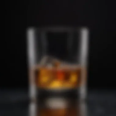 Elegant Whisky Glass An elegant whisky glass filled with a rich amber liquid, set against a dark background.