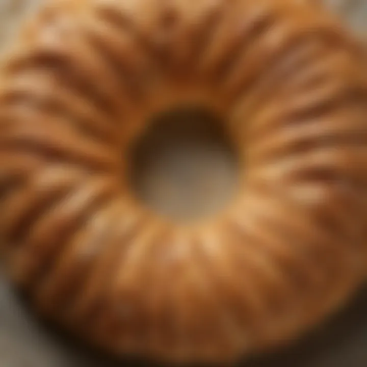 A close-up of the golden, flaky texture of a freshly baked kringle, highlighting its craftsmanship.