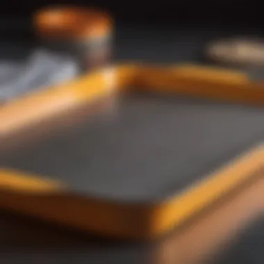 A close-up view highlighting the materials and construction of the Le Creuset baking sheet