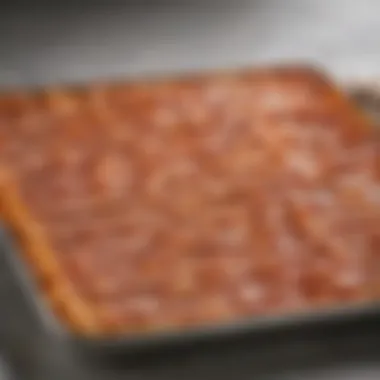 Golden-Crisp Bacon Delight A tray of perfectly baked bacon strips with a golden-brown crisp