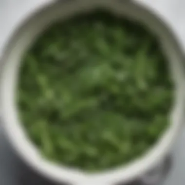 An array of greens being blanched, with steam rising, illustrating the vibrant colors during the cooking process.