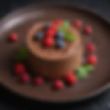 Decadent chocolate mousse garnished with berries and mint