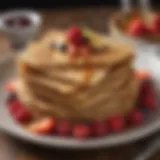 A stack of golden-brown matzo meal pancakes garnished with syrup and fresh fruit.