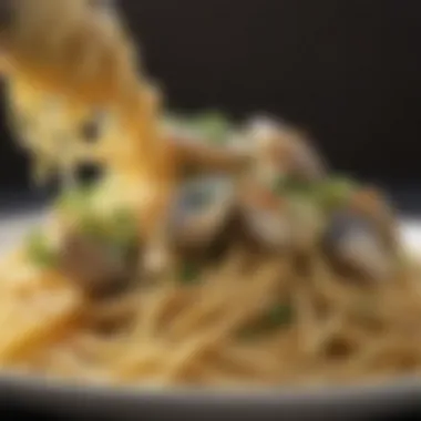 A close-up of freshly cooked linguine coated in clam sauce with herbs.