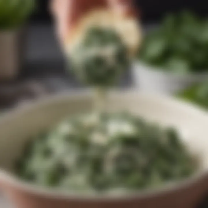 A close-up of silky cream cheese being blended into the spinach mixture