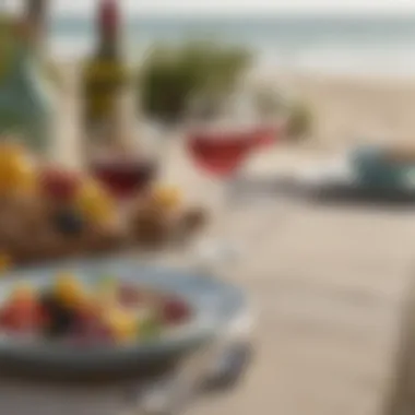 A beautifully set summer table featuring wine glasses adorned with charming beach motifs.