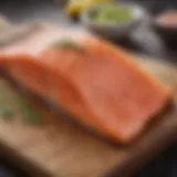 Fresh salmon fillet displayed on a wooden cutting board